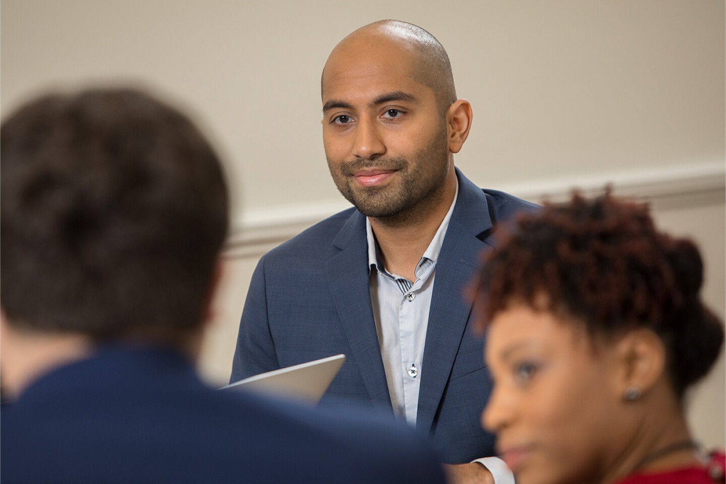 Group of three people in a meeting