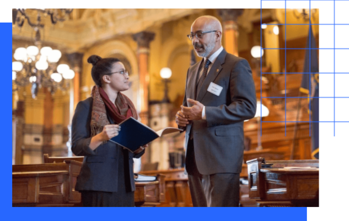 Female student discussing class lecture with male professor.