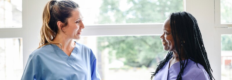 two nurses talking to eachother