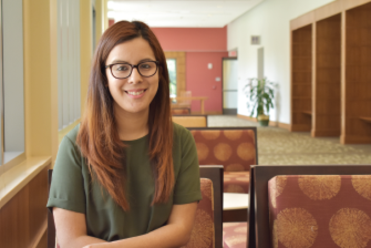 Smiling young woman with glasses