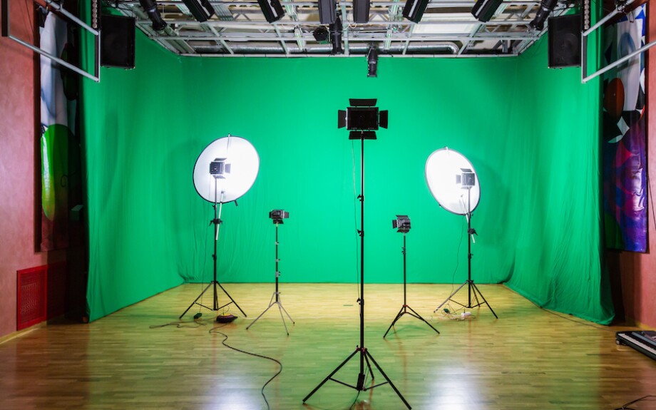 Green screen studio with proper lighting setup, including key lights.