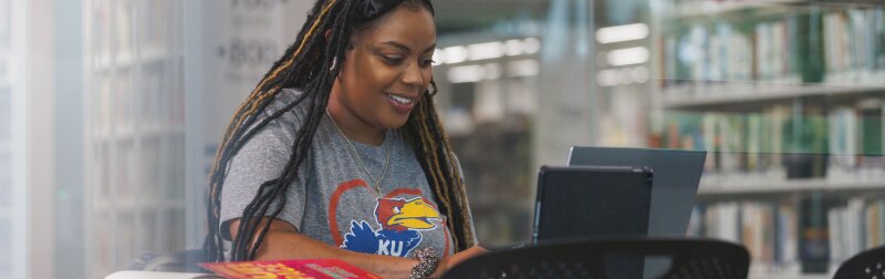 Paige Freeman poses for remote learning shots for Jayhawk Global stock at the Lawrence Public Library.