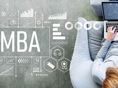 MBA with man using a laptop