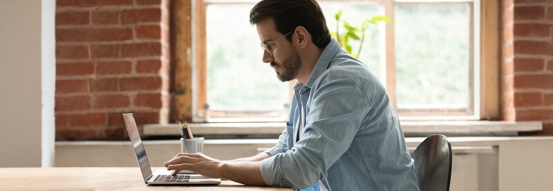 Man sitting at a laptop