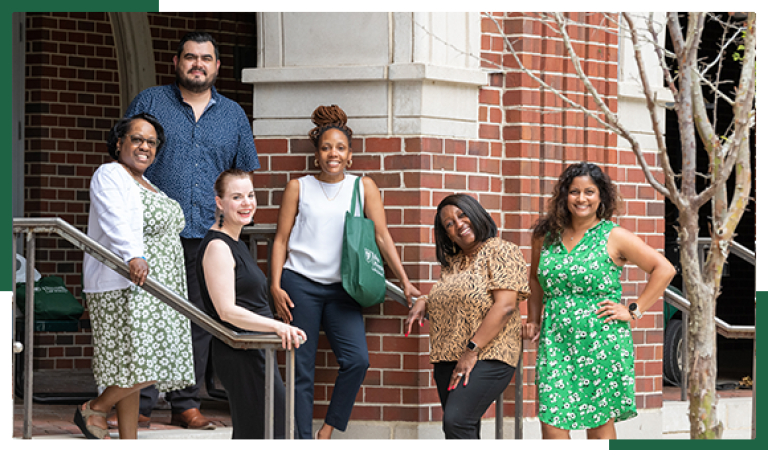 Diverse group of Tulane students on stairs outside building on campus.