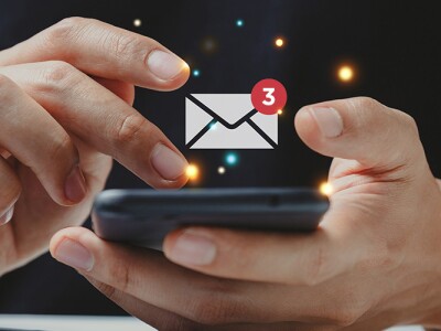 Hand of businessman using smartphone for email with notification alert