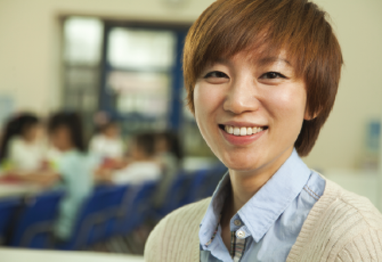 asian woman with short hair smiling