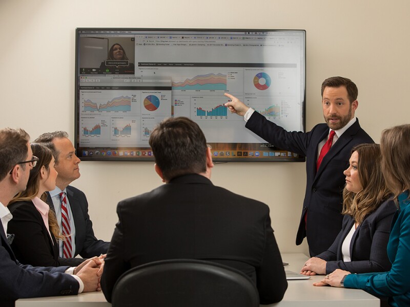 Meeting with analytics being presented to a group