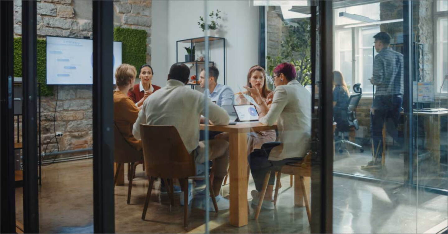 Diverse Group of Professional Businesspeople Meeting in the Modern Office Conference Room