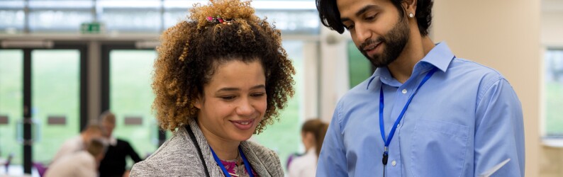 administrator and teacher looking at documents