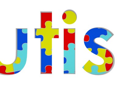 word autism drawn in puzzles