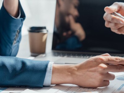 Accountants discussing numbers on a chart during a business meeting