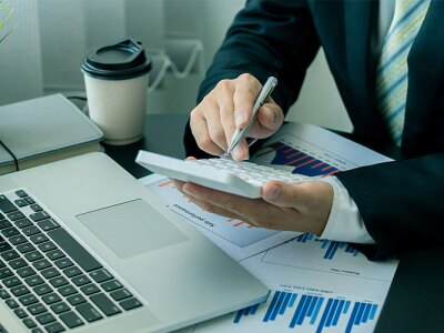 An accountant using a calculator