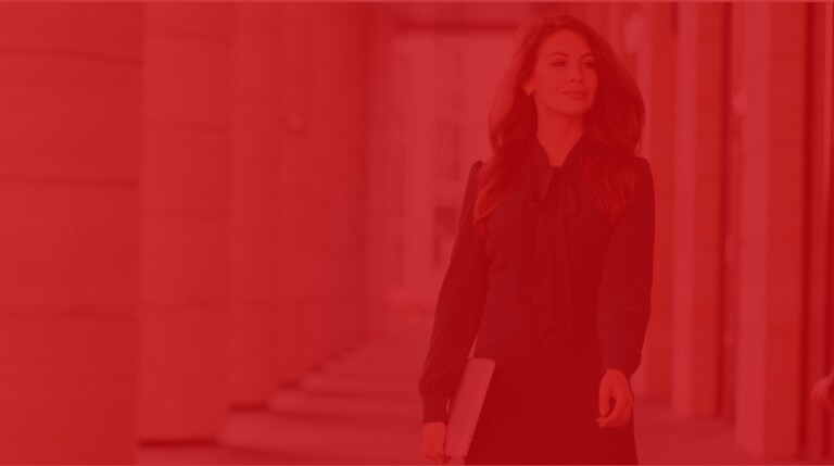professional student confidently walks through hall of MSOE building