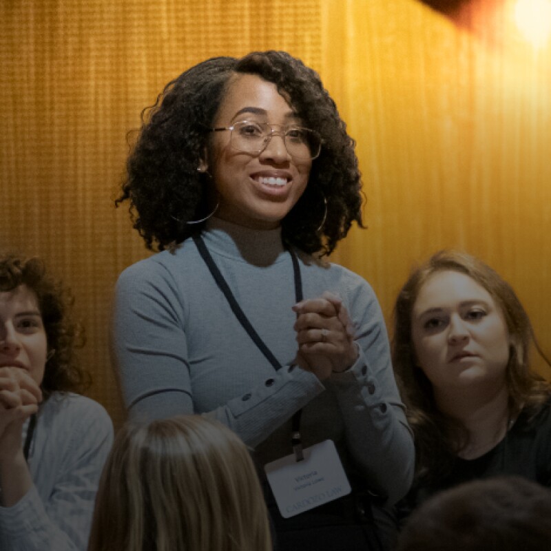 student standing to address a classroom