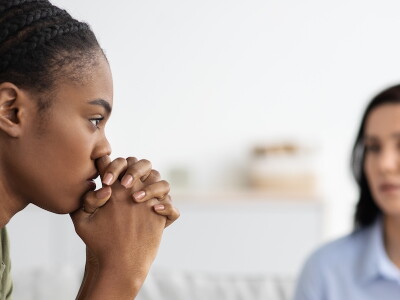 A service member talks with an attentive counselor