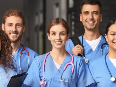 Group of nursing students in corridor of medical university.