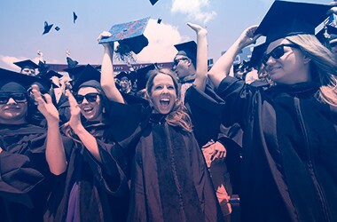 graduates in cap and gowns