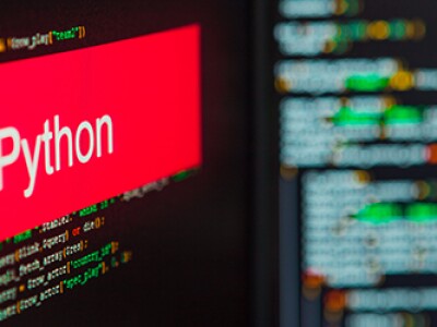 red box white word python left in front of computer code
