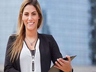 woman-in-white-shirt-zipper-holding-clipboard