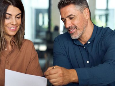 Professional accountant group working with documents at meeting in office.