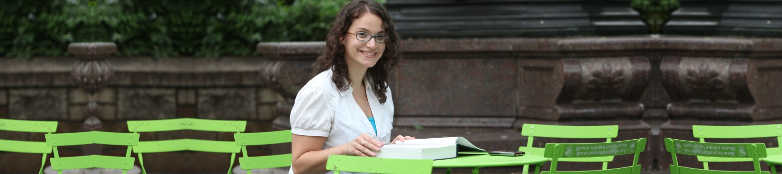 Student works at a table in NYC park