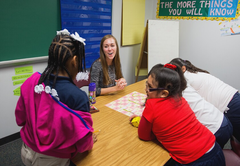 Woman-working-with-children-in-classroom