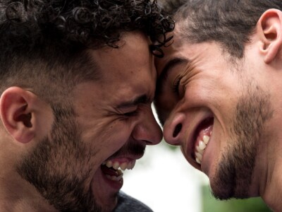 Two men smiling and laughing together