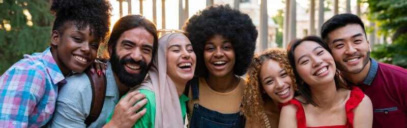 Group of young multiracial friends traveling in the city.