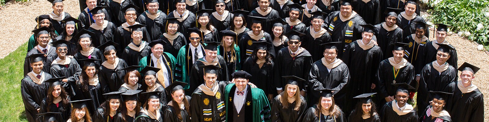 William-and-Mary-Graduates-Standing-In-Crowd-Smiling