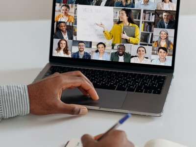 Online learning. Man at home watching an online webinar