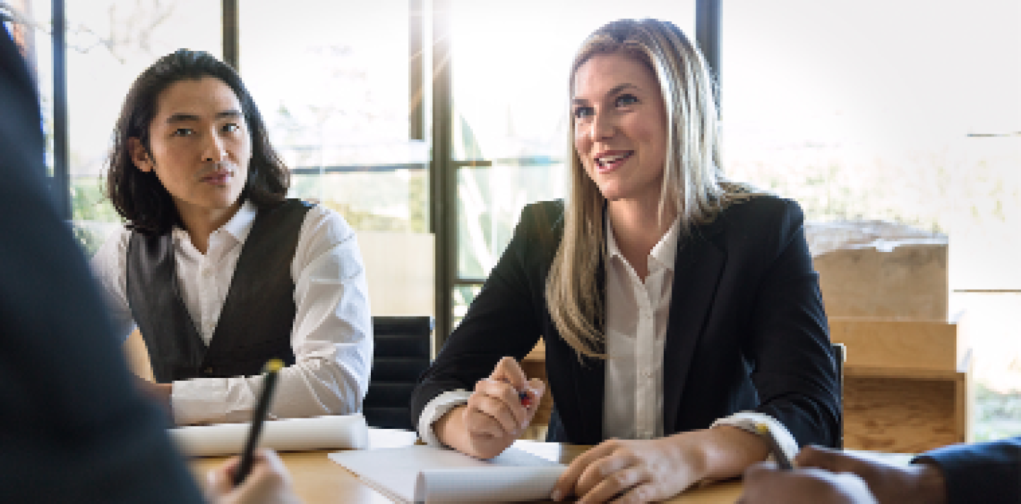 group of business people in suites having a conversation