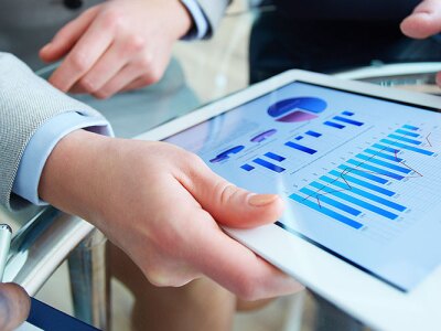 people looking at Business intelligence analyst dashboard on virtual screen