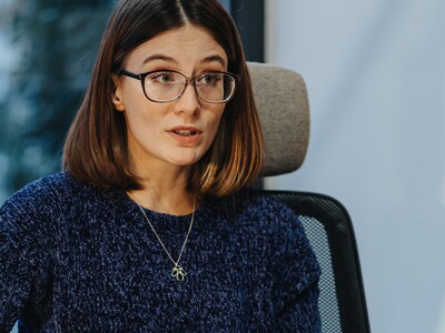 Professional women engaged in discussion with a recent graduate