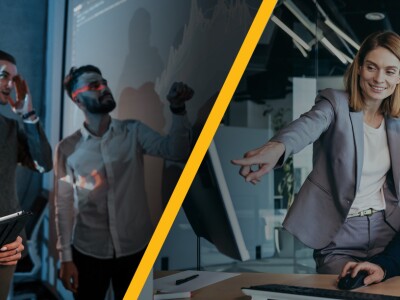 Data Analysts on the left looking at a large screen of data split with two Business Analysts taking at a work station