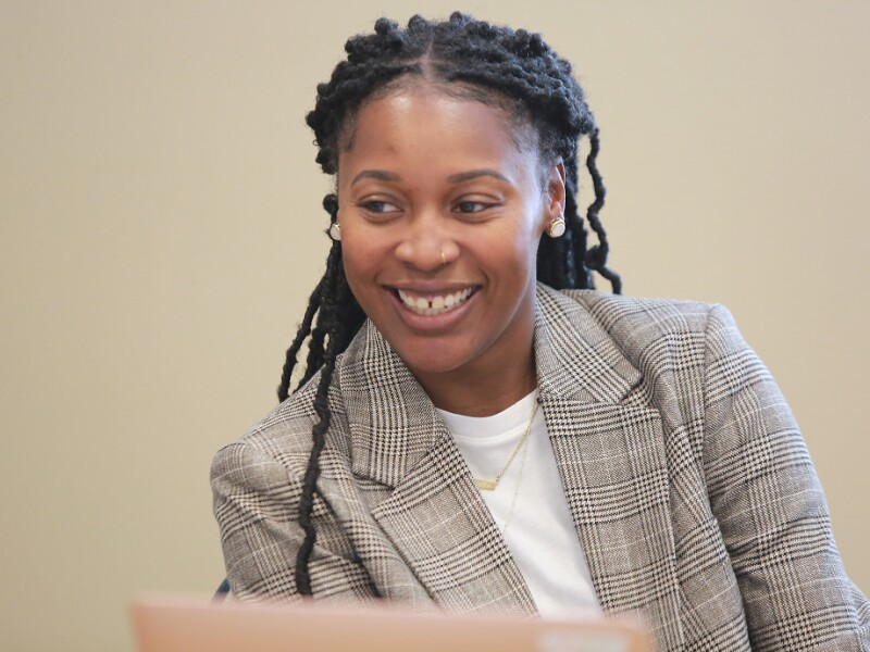 Smiling student working at her laptop