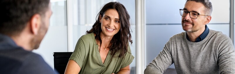 A couple meeting a financial advisor.