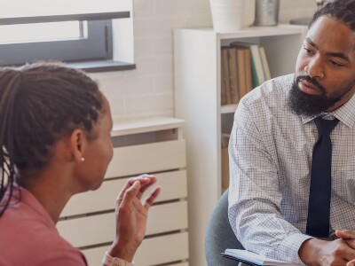 African American male counselor in session with African American female