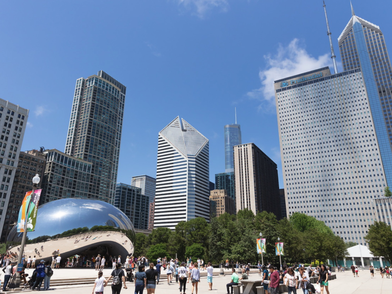 An angled view of the Chicago skyline with Cloud Gate statue