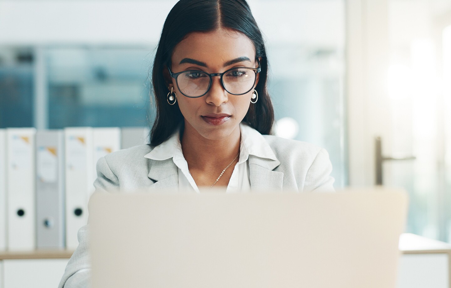 Healthcare administrator working at her laptop