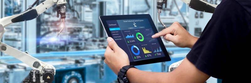 An engineer works on a tablet computer