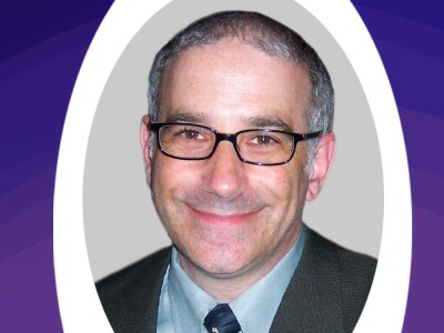 Faculty Spotlight featuring a Headshot of Roy Wollen