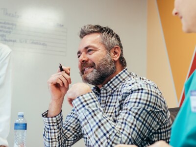 healthcare workers surrounding boss