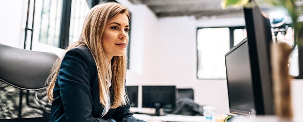 Woman at computer working in accounts receivable department