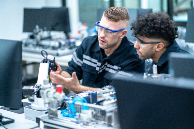 Two mechanical engineers working together in a lab