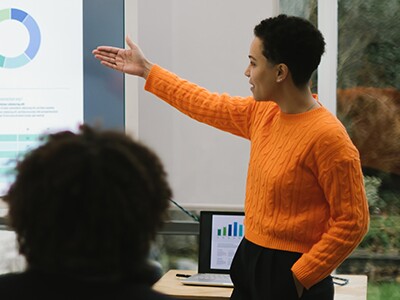 Educator presenting data to colleagues