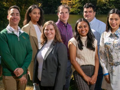 Group of 2024 William & Mary’s Fall 2024 Residency Weekend attendees standing near the lakeshore.