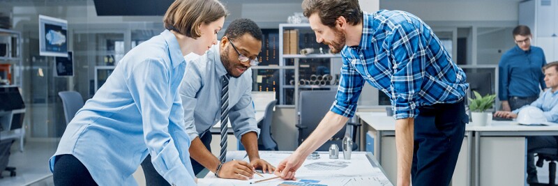 Female Designer Works with Industrial Engineer and Master Technician on product improvements