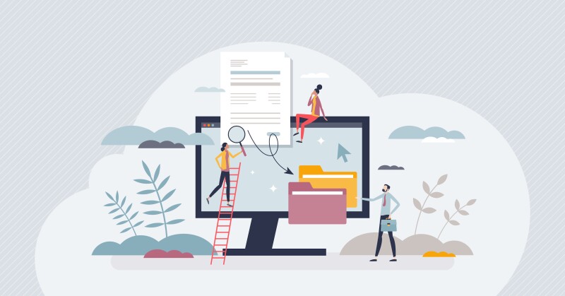 A group of people examining a set of digital files on a computer