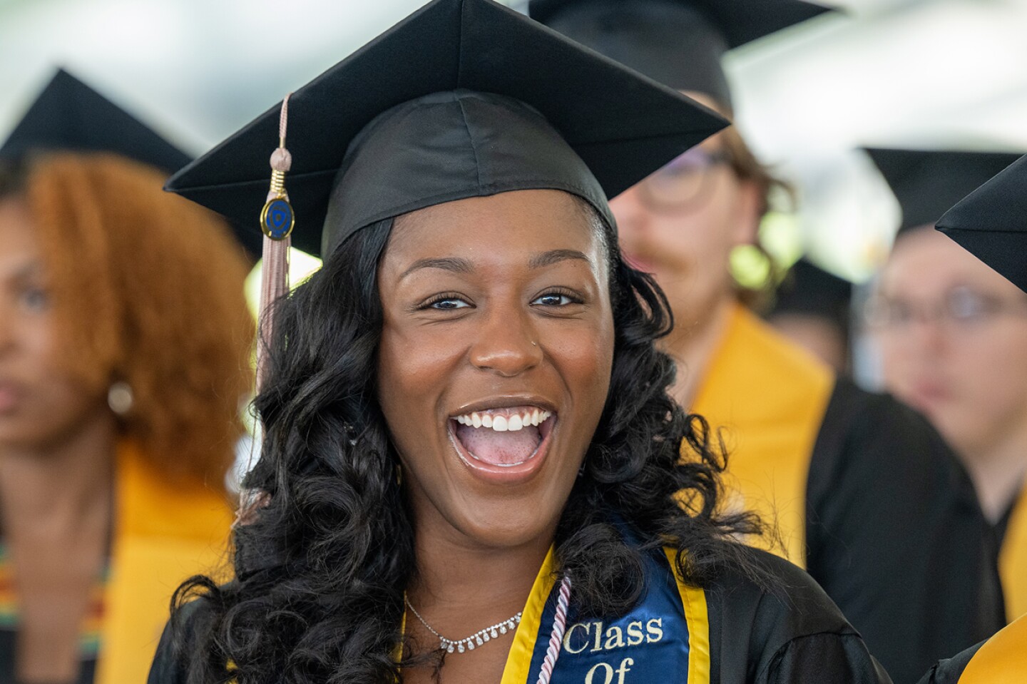 Smiling Kent State University graduate